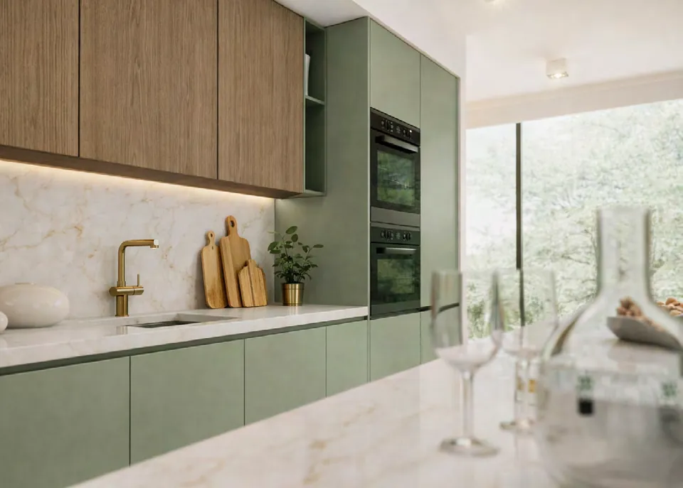 Cocina con muebles bajos y columnas en verde salvia mate